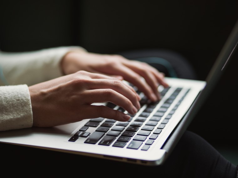 A person working on laptop.