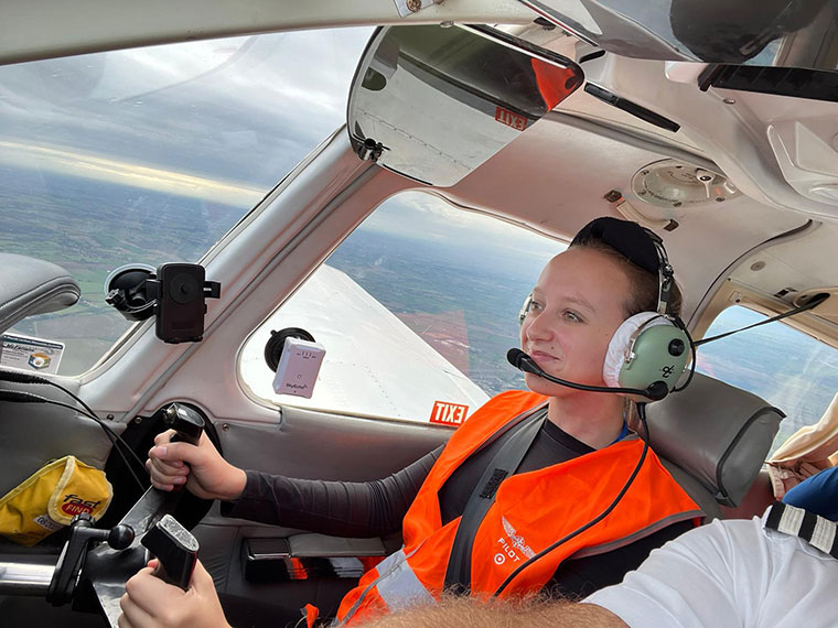 A student flying a plane on our aviation course