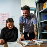 An adult learner talking to a lecturer