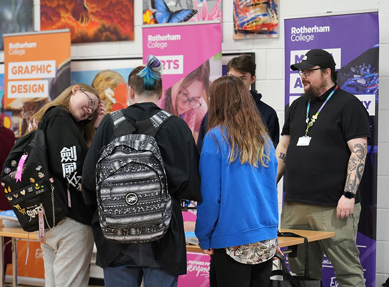 Students talking to staff at a Rotherham College open event