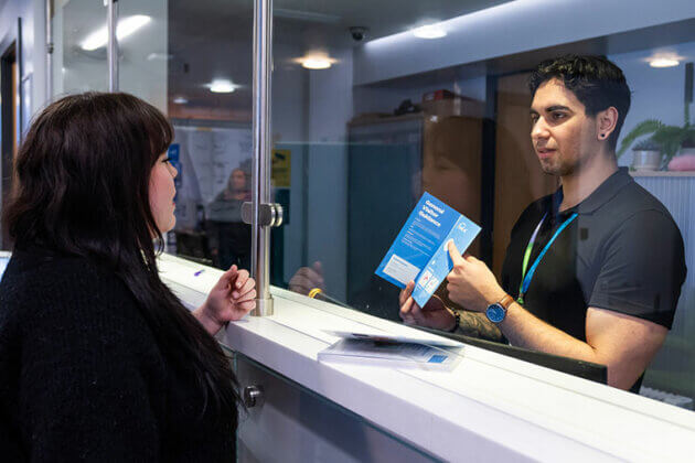 A member of staff and a student at Rotherham College