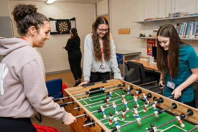 Students playing table football