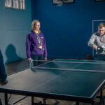 Students playing table tennis