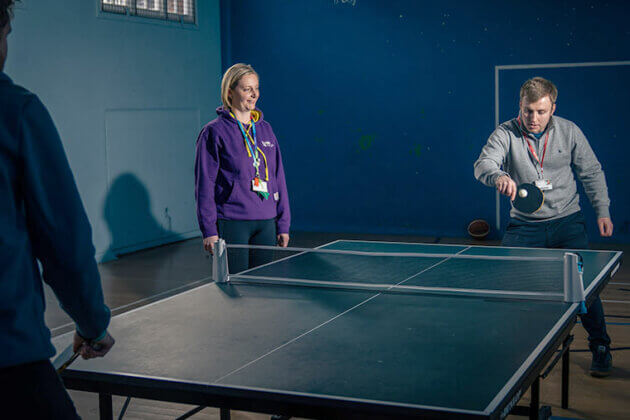 Students playing table tennis