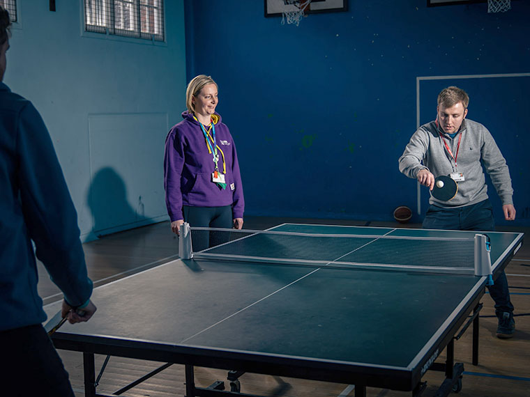 Students playing table tennis