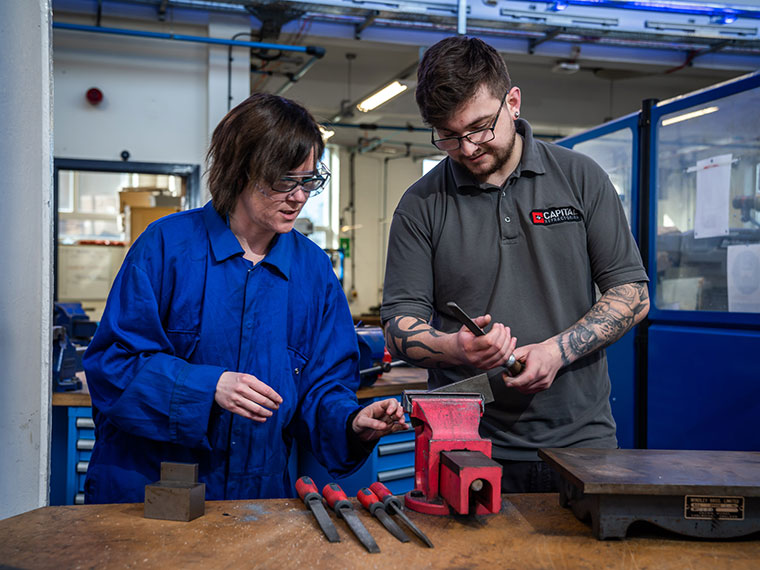 An engineering student being supported by a lecturer