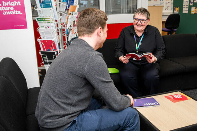 A careers adviser talking to a student