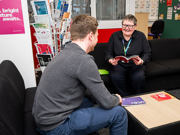 A careers adviser talking to a student