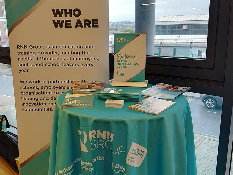 A table and banner display at the RNN Group Business Breakfast