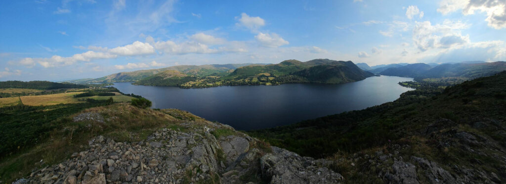 A landscape of hills and a lake