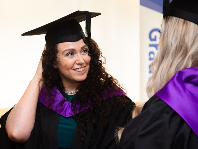 A head and shoulders shot of a student at graduation 2023