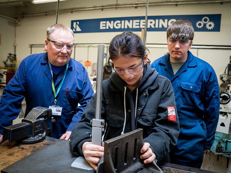 A lecturerer with two engineering students