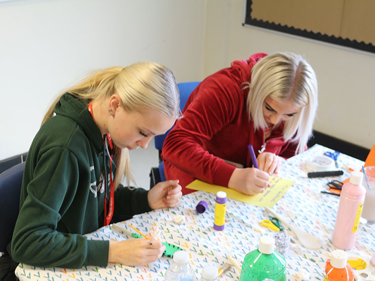 Students painting during the Intercollege 2025 competition