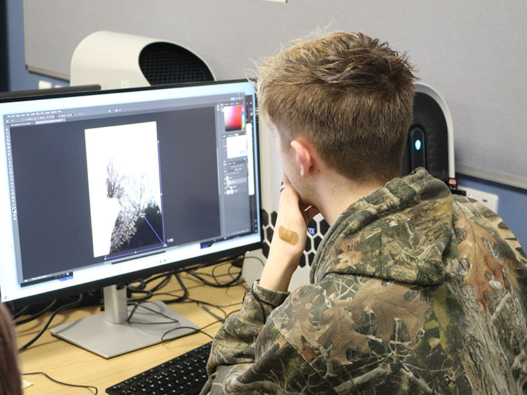 A student working on a computer during the Intercollege 2025 competition