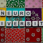 Letters spelling our neurodiversity on a colourful patchwork background